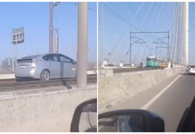 (УЗНЕМИРУЈУЋИ ВИДЕО) ВОЗИО У СУПРОТНОМ СМЕРУ НА МОСТУ НА АДИ ПО ШИНАМА, А ОНДА ЈЕ НАИШАО ТРАМВАЈ! Кренуо у рикверц, нико не зна како је доспео на овај део пута